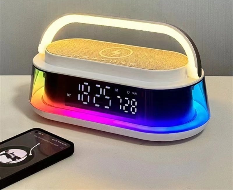 Modern alarm clock with colorful display and wireless charging pad on a table.