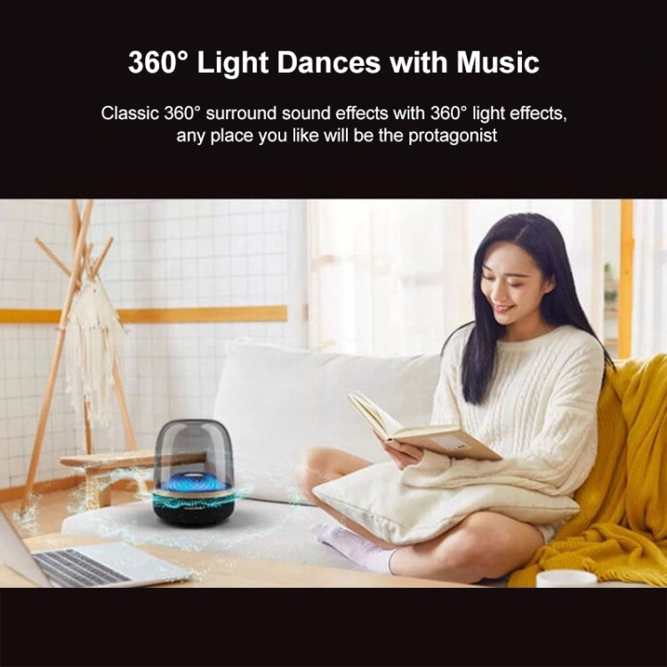 Woman reading a book on a couch with a 360-degree light device in front of her, text about music and light effects.