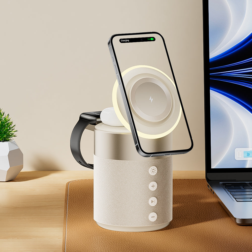 Smart mug with wireless charging pad on a desk next to a laptop