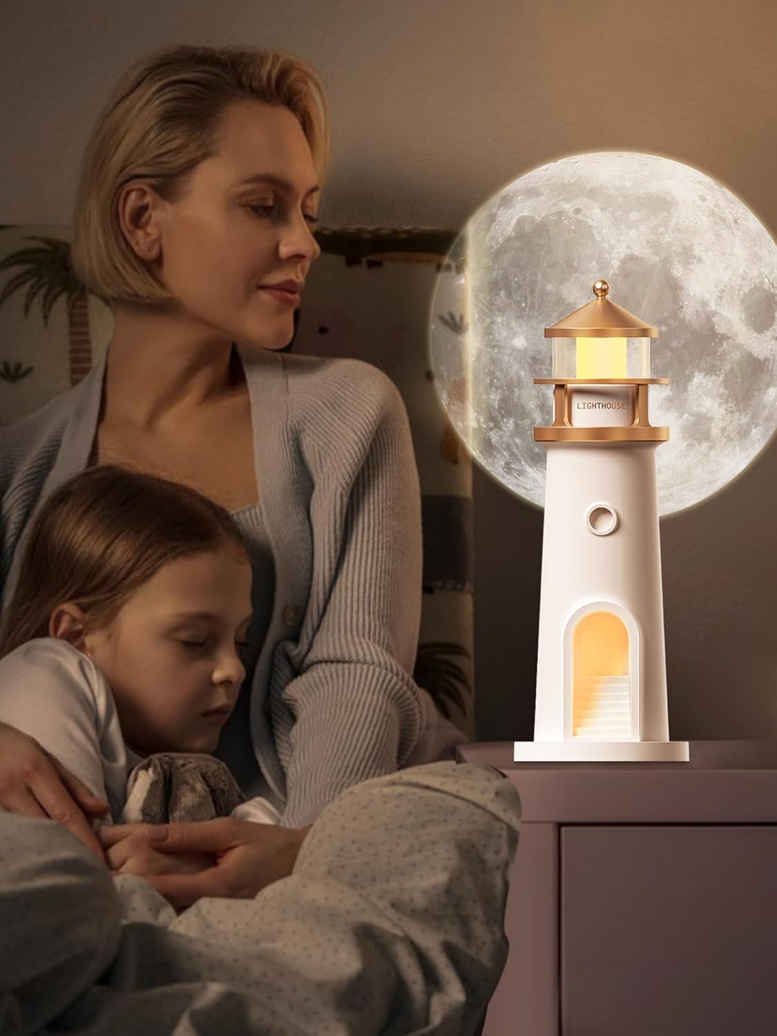 Woman and child sitting together with a lighthouse-shaped lamp in the foreground and a moonlit sky in the background.
