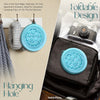 Blue silicone holder with honeycomb design on a bag and wall hook, with text about its uses.