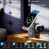 Digital alarm clock with smartphone stand and watch holder on a wooden surface.